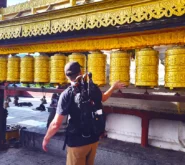 Spinning prayer wheels at the Monkey Temple on a Kathmandu City Tour with Himalayan Peace Treks.