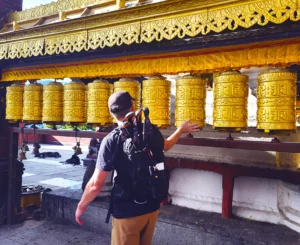 Spinning prayer wheels at the Monkey Temple on a Kathmandu City Tour with Himalayan Peace Treks.