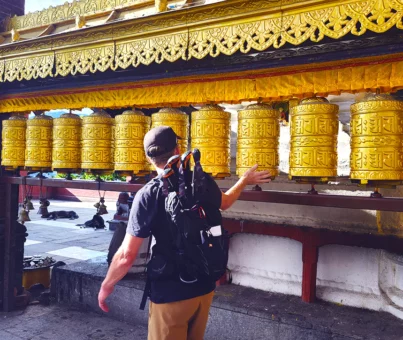Spinning prayer wheels at the Monkey Temple on a Kathmandu City Tour with Himalayan Peace Treks.