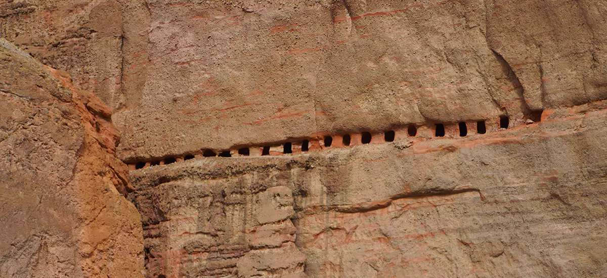 caves carved in the cliff as seen during the Upper Mustang trek